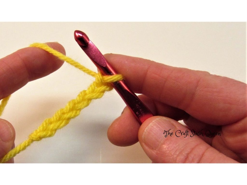 A crocheted chain on a crochet hook.