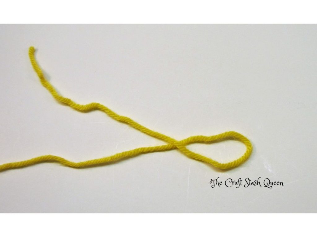 Yellow yarn in a loop.