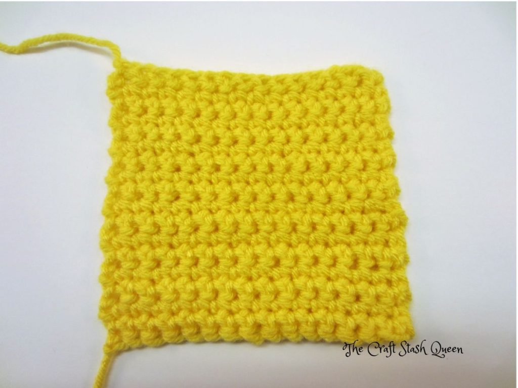 Swatch of single crochet 15 in yellow yarn.